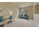 Neutral office space featuring cozy couch, desk, and big window providing natural light at 15886 E Stargazer Ln, Parker, CO 80134