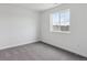 Cozy bedroom with large windows offering neighborhood views and soft, neutral carpeting for comfort at 39152 Clymer St, Elizabeth, CO 80107