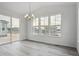 Bright dining area with large windows and sliding door, providing ample natural light at 39152 Clymer St, Elizabeth, CO 80107
