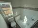 Updated bathroom featuring a tiled shower and modern fixtures at 9036 Mandel St, Denver, CO 80260