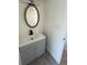 Bathroom featuring a vanity and an oval mirror at 9036 Mandel St, Denver, CO 80260