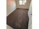 This bedroom has neutral paint and carpet, a window, and is ready for personalization at 9036 Mandel St, Denver, CO 80260