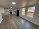 Open-concept kitchen with stainless steel appliances, and plenty of natural light at 9036 Mandel St, Denver, CO 80260