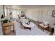 Bright and airy living room with neutral decor, comfortable seating, and stylish accents at 9036 Mandel St, Denver, CO 80260