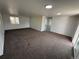 Spacious living room with new carpet and recessed lighting at 9036 Mandel St, Denver, CO 80260