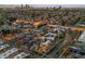 Gorgeous neighborhood aerial view shows many updated houses with manicured lawns in an urban setting at 2539 E 5Th Ave, Denver, CO 80206