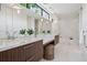 Modern bathroom with marble countertops, sleek vanities, pendant lighting, and a luxurious soaking tub at 2539 E 5Th Ave, Denver, CO 80206