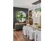 Contemporary dining area with chic light fixture, round mirror, and modern decor for elegant dining at 2539 E 5Th Ave, Denver, CO 80206