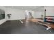 Spacious home gym features rubber flooring, mirrored wall, and modern exercise equipment at 2539 E 5Th Ave, Denver, CO 80206