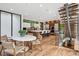 Bright eat-in kitchen offers an island with seating and direct access to stairs at 2539 E 5Th Ave, Denver, CO 80206