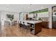 Beautiful kitchen has a large center island, stainless appliances, and hardwood floors at 2539 E 5Th Ave, Denver, CO 80206