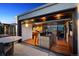 Outdoor kitchen blending seamlessly with indoor living, featuring bar seating and great views at 2539 E 5Th Ave, Denver, CO 80206