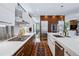 This gourmet kitchen is equipped with stainless steel appliances, sleek cabinetry, and a breakfast bar at 2539 E 5Th Ave, Denver, CO 80206