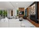 Modern living room features a fireplace, wood accents, and comfortable seating arrangements at 2539 E 5Th Ave, Denver, CO 80206