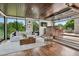 Modern living room featuring a bar area, comfortable seating, and a large window with a view at 2539 E 5Th Ave, Denver, CO 80206