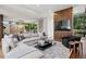 Open-concept living room featuring hardwood floors and an expansive sectional sofa at 2539 E 5Th Ave, Denver, CO 80206