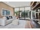Cozy living room with modern decor, comfortable seating, and sliding glass doors leading to a balcony at 2539 E 5Th Ave, Denver, CO 80206