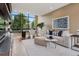 Stylish living room featuring a comfortable sofa, modern furniture, and a large window with scenic views at 2539 E 5Th Ave, Denver, CO 80206