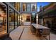 Outdoor patio features dining area, and seamless transition to living room with large sliding doors at 2539 E 5Th Ave, Denver, CO 80206