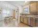 Bright dining area features hardwood floors, big window, and modern lighting fixtures at 1355 Hudson St, Denver, CO 80220