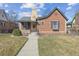 Charming brick home with a well-maintained front yard and a quaint, welcoming walkway at 1355 Hudson St, Denver, CO 80220