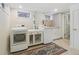 Functional laundry room features a washer, dryer, and ample storage space at 1355 Hudson St, Denver, CO 80220