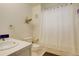 Charming bathroom with a shower curtain and whimsical wall decorations at 2931 S Cook St, Denver, CO 80210