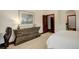 Bedroom featuring an eye-catching dresser and doorway to another room at 2931 S Cook St, Denver, CO 80210