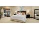 Bright bedroom with a king bed, balcony, and comfortable furnishings at 2931 S Cook St, Denver, CO 80210