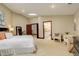 Spacious bedroom with a skylight, neutral colors, and access to a bathroom at 2931 S Cook St, Denver, CO 80210