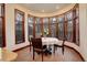 Charming breakfast nook with large bay window and a round table perfect for casual dining at 2931 S Cook St, Denver, CO 80210