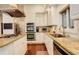 Close-up of modern kitchen with stainless steel appliances, granite counters, and white cabinetry at 2931 S Cook St, Denver, CO 80210