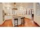 Spacious kitchen with white cabinets, stainless steel hood, hardwood floors and granite countertops at 2931 S Cook St, Denver, CO 80210