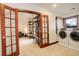 Laundry room featuring modern appliances, a window with natural light, and easy access to the loft at 2931 S Cook St, Denver, CO 80210