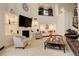 Living room with fireplace, built-in shelves, and comfortable seating, perfect for relaxation and entertaining at 2931 S Cook St, Denver, CO 80210