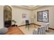 Comfortable home office boasts a fireplace with stone surround, and a glass desk with stylish chairs at 2931 S Cook St, Denver, CO 80210