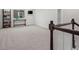Open bonus room has neutral carpet, a window and a modern wood railing at 5223 Gray Wolf Ln, Castle Rock, CO 80104