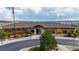 Exterior view of the community clubhouse with lush landscaping and ample parking at 5223 Gray Wolf Ln, Castle Rock, CO 80104