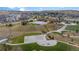 Aerial view of community amenities, including pool, playground, and basketball court, set in a scenic neighborhood at 5223 Gray Wolf Ln, Castle Rock, CO 80104