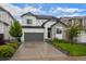 Charming two-story home with a gray garage door, stone accents and a well-manicured lawn at 5223 Gray Wolf Ln, Castle Rock, CO 80104