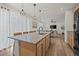 Spacious kitchen island with granite countertops, pendant lighting, and an open view to the living area at 5223 Gray Wolf Ln, Castle Rock, CO 80104