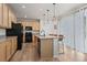 Well-equipped kitchen with a large island, granite countertops, and stainless steel appliances at 5223 Gray Wolf Ln, Castle Rock, CO 80104