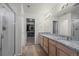 A spacious main bathroom features a walk-in closet, shower and a granite countertop at 5223 Gray Wolf Ln, Castle Rock, CO 80104