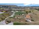 A bird's-eye view of park and playground area with winding paths and terraced landscaping in a housing community at 5223 Gray Wolf Ln, Castle Rock, CO 80104