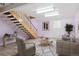 Living area in the basement, complete with stairs at 6400 E Mississippi Ave, Denver, CO 80224