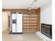 Basement with tile floors, built-in shelving and a white refrigerator at 6400 E Mississippi Ave, Denver, CO 80224