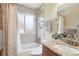 Bathroom with shower, granite countertops, updated fixtures and natural light at 6400 E Mississippi Ave, Denver, CO 80224