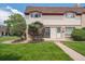 Charming townhome with a well-manicured lawn and tidy landscaping, offering curb appeal at 6400 E Mississippi Ave, Denver, CO 80224