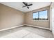 Bedroom features neutral walls, carpeted floors, and a window that allows for natural light and scenic views at 7351 S Marion St, Centennial, CO 80122