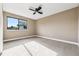 Bedroom features neutral walls, carpeted floors, and a window that allows for natural light at 7351 S Marion St, Centennial, CO 80122